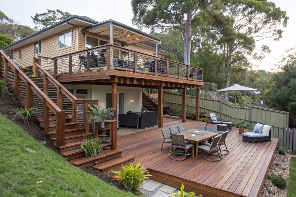 Multi-level deck extension creating separate entertaining zones on sloped Central Coast block