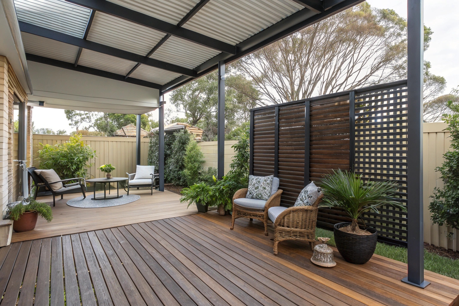 Timber deck patio with privacy screens and outdoor lounge area in Central Coast